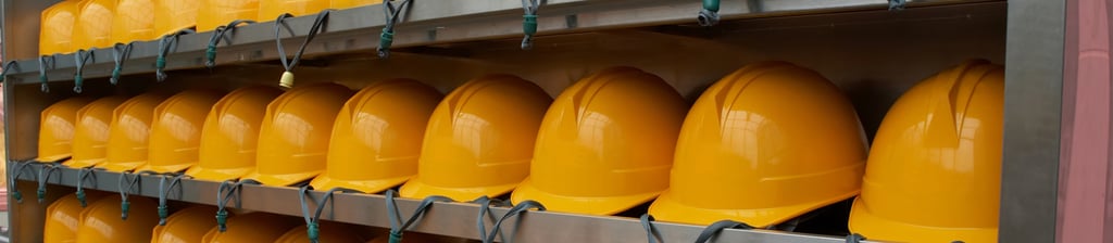 yellow hard hats on shelves