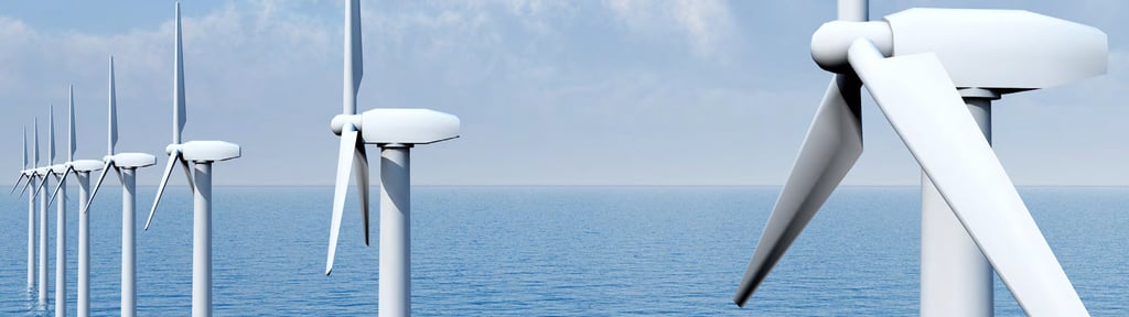 Line of offshore wind turbines leading away from the camera.