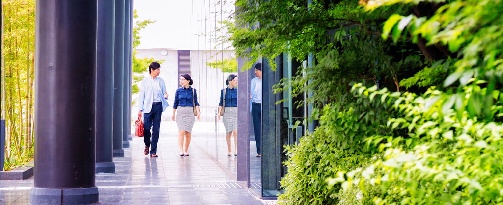 People walking outside an office building