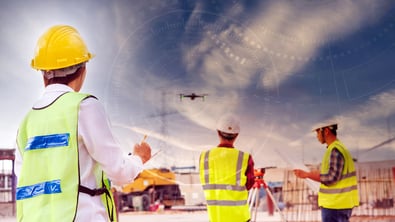 Engineers using drone with measurements overlay