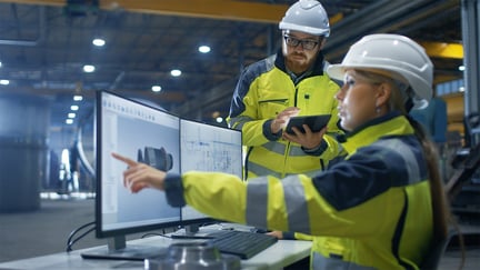 Industrial Engineer Works on Personal Computer