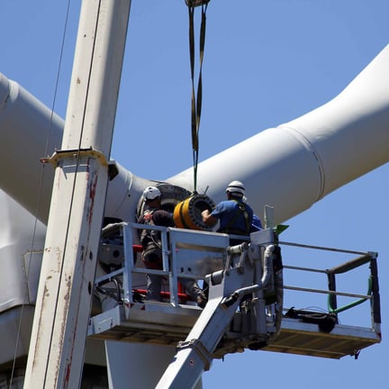 Engineers fixing a wind turbine