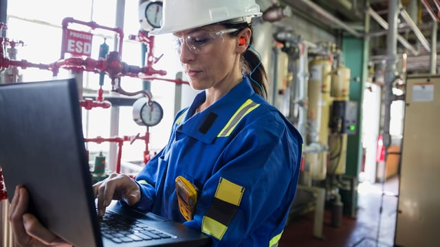 Female engineer working on laptop